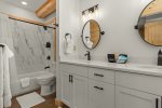 Full ensuite bath to primary bedroom, double vanity, tile tub/shower